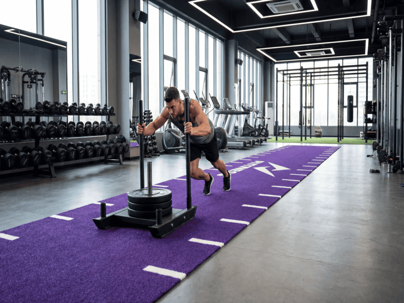 Production manager checking turf density in factory